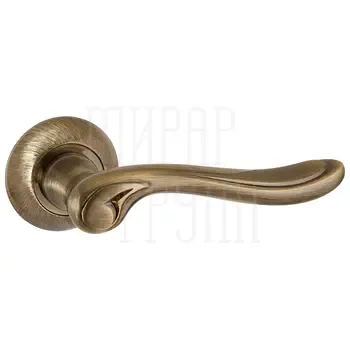 Дверная ручка Punto (Пунто) на круглой розетке "ONDA" TL