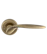 Дверная ручка Extreza "Calipso" (Калипсо) 311 на круглой розетке R03