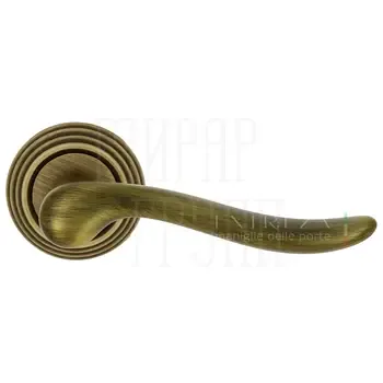 Дверная ручка Extreza "Toledo" (Толедо) 323 на круглой розетке R05