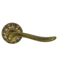 Дверная ручка Extreza "Toledo" (Толедо) 323 на круглой розетке R04