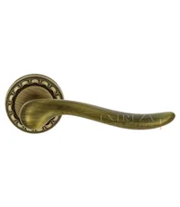 Дверная ручка Extreza "Toledo" (Толедо) 323 на круглой розетке R02