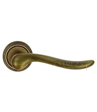 Дверная ручка Extreza "Toledo" (Толедо) 323 на круглой розетке R01